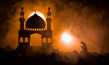 A man praying based on the teachings of Islam to encourage defiling innocents, harming non-believers, and oppressing women.